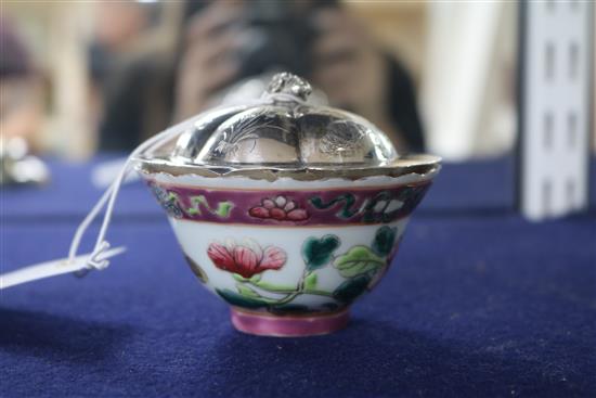 A Chinese silver dish and a porcelain bowl.